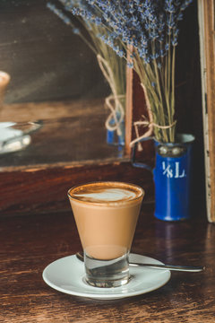 cup of coffee on wooden table