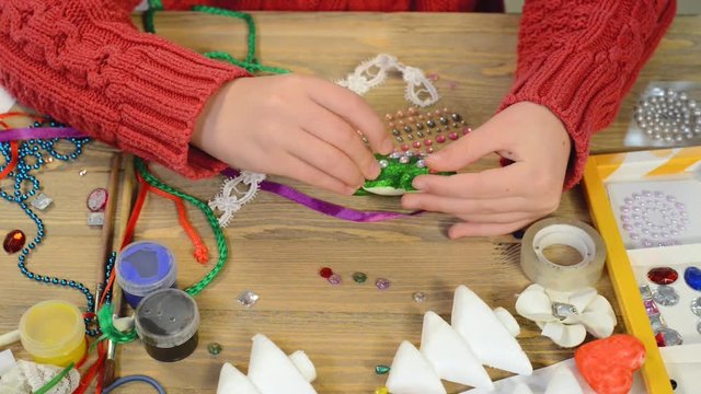 Children making decoration for holidays, crafts and toys, christmas tree and other. Painting watercolors. Top view. Artwork workplace with creative accessories. Flat lay art tools.