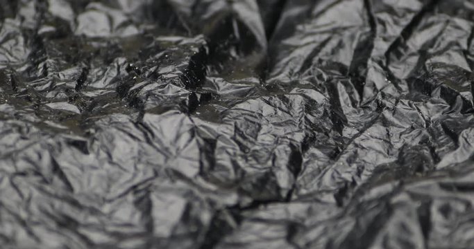 Crumpled black plastic bag