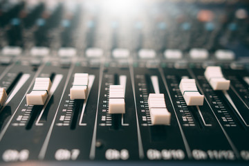 Equalizer console. Digital sound audio mixer closeup . Studio music recording equipment.