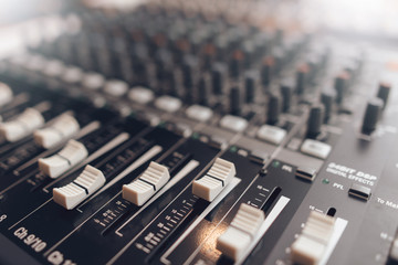 Fototapeta na wymiar Digital sound audio mixer closeup . Equalizer console. Studio music recording equipment. 