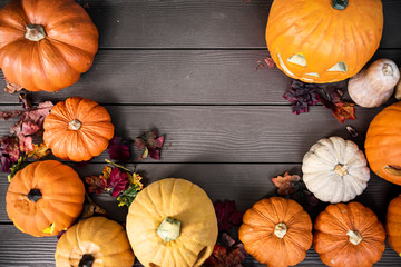Halloween pumpkins on wooden background