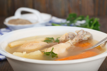 Homemade healthy Chicken clear noodle soup - broth. Hot chicken soup for cold and flu.