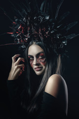 Terrible horror Halloween Vampire Woman portrait. Beauty Vampire Witch lady with blood on mouth...