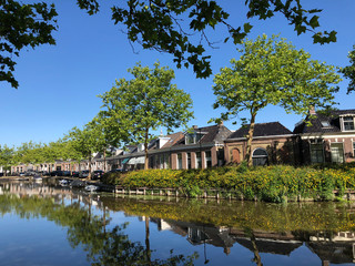 Fototapeta na wymiar Houses next to the city canal of Bolsward