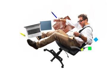 Young male employee falling from the chair