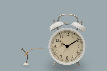 Rope tie with nails and alarm clocks.