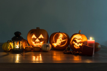 Halloween decorated pumpkins with candles and a lantern