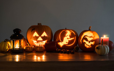 Halloween decorated pumpkins with candles and a lantern