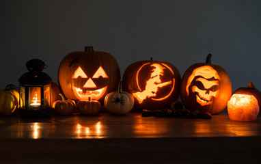 Halloween decorated pumpkins with candles and a lantern