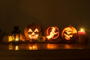 Halloween decorated pumpkins with candles and a lantern