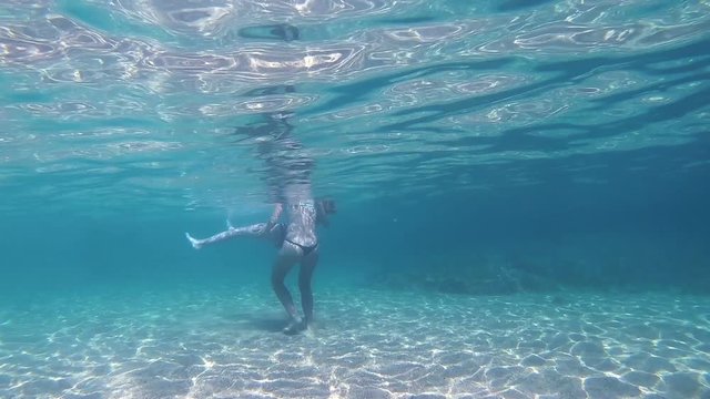 girls in thong play underwater