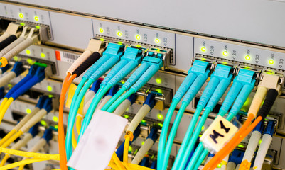 Optical links of high-speed Internet connection. Front panel of the main router of the network access provider. Primary Data Center Server