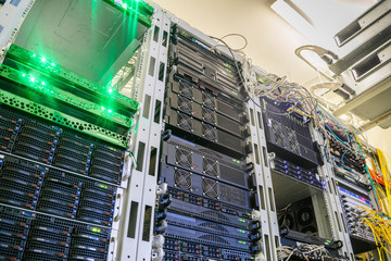 Access servers are located in a modern data center. Powerful computer equipment works in the server room rack. Cloud data storage services. Bottom view
