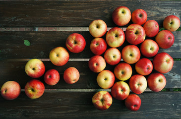Red apples on wooden boards.