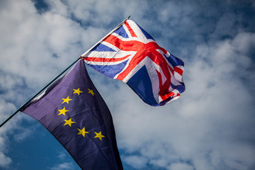 European union and British Union jack flags flying together. Brexit concept