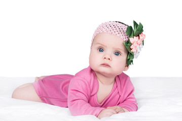 cute little baby girl with bow flower on her head, isolated on white