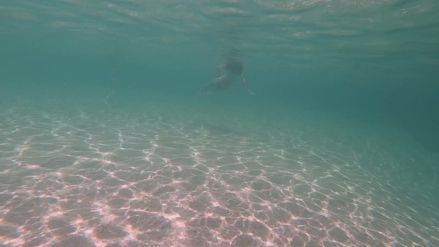 girls in thong play underwater