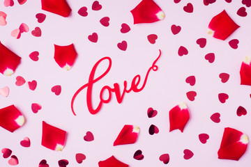 Background of rose Petals and red hearts. The Concept Of Valentine's Day