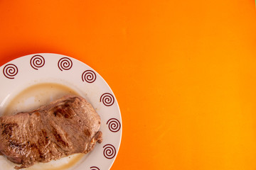 piece of beef steak on white plate
