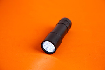 LED flashlight, in colorful background