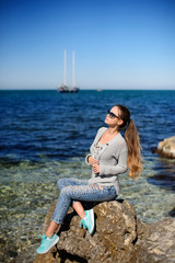 Beautiful girl in autumn day outdoors. Girl with long hair. Girl in sunglasses