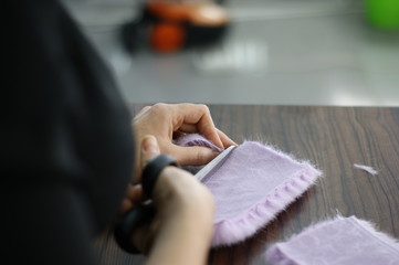 Dressmaker cutter. Clothing designer. Process.