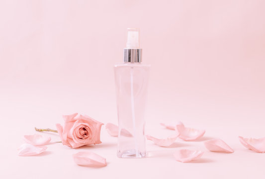 perfume bottle with rose petal