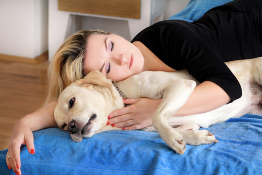 Women sleeping shop with dogs