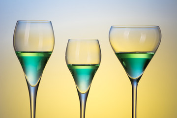 three glasses with cocktails