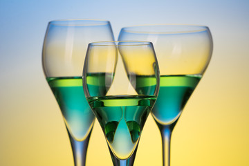 three glasses with cocktails