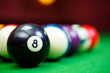 billiard balls on a green pool table, closeup
