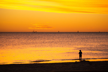 Fototapeta premium Landscape of silhouettes persons orange colors and contrast