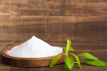 Natural sweetener in powder from stevia plant - Stevia rebaudiana. Top view
