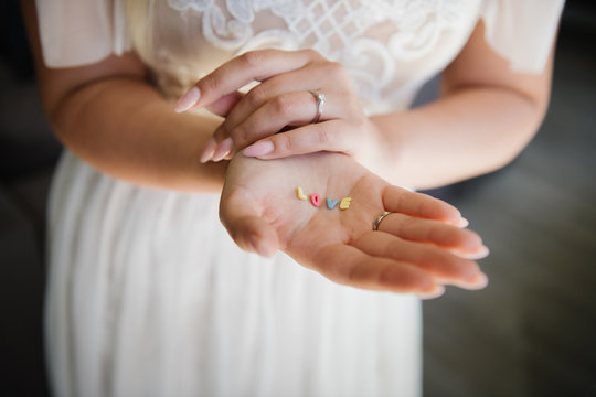 Bride showing word love in her hands