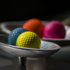 Isolated colorful golf balls
