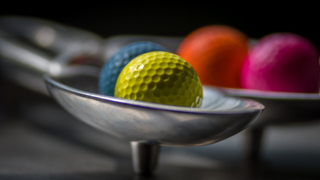 Isolated colorful golf balls