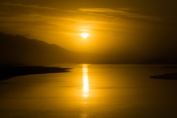 Sunset tropical Cofete beach landscape with silhouettes of hills in Fuerteventura.