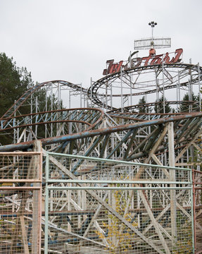 Abandoned rusty merry-go-round in park