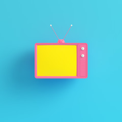 Pink retro styled tv with yellow screen on bright blue background in pastel colors