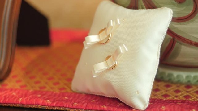 Wedding rings resting on commode