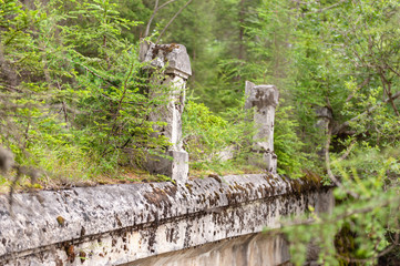 Impression of an old, abandoned bridge in the Italian Dolomites, somewhere along the route between...