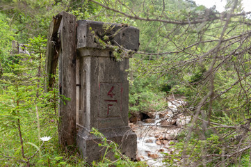 Impression of an old, abandoned bridge in the Italian Dolomites, somewhere along the route between...