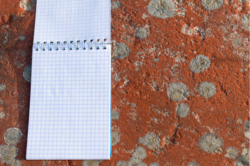 notepad on stone