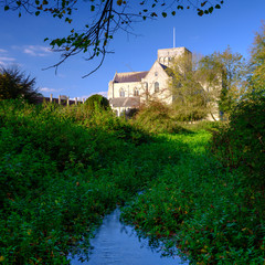 Hospital of St Cross and Almhouses of Noble Poverty, in autumn warm evening sunlight, Winchester, Hampshire, UK