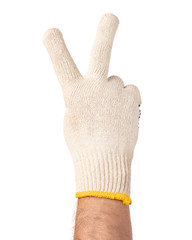 Obraz premium Worker showing gesture - two fingers, victory sign. Male hand wearing working cotton glove, isolated on white background.