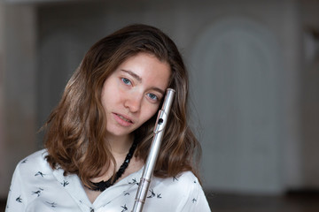 Beautiful young woman with flute Genre portrait of young beautiful girl