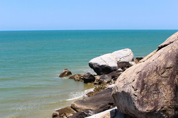 Rocky sea, bright sky.