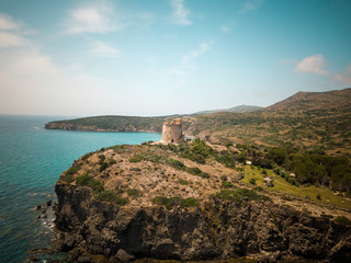 Fototapeta na wymiar Landscape of beautiful sardinian coast with ancient tower