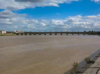 cityscape. view of Bordeaux river bridge against cloudy blue sky Bordeaux, France